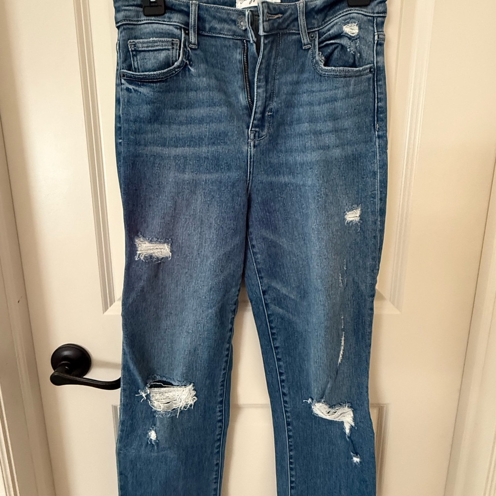 Carly Jean Los Angeles Distressed Skinny Jeans in Blue. Chrissy jeans